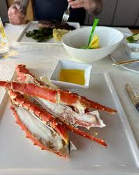 The Crow's Nest Restaurant signature dishes The menu features local resources like Bering Sea king crab legs and venison loin, with specific dishes including Duroc Pork Chop and Oysters.